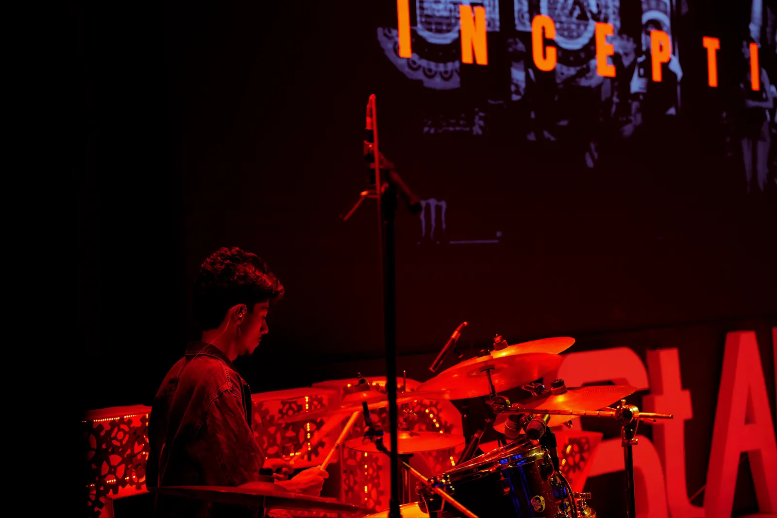 Drums washed in red light
