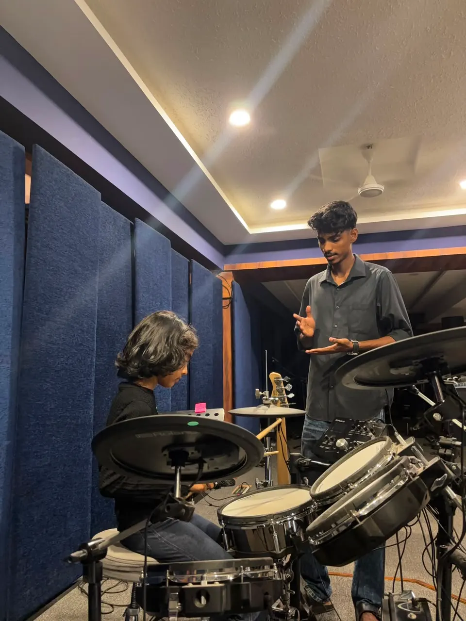 A one-to-one lesson on the electronic kit in the studio